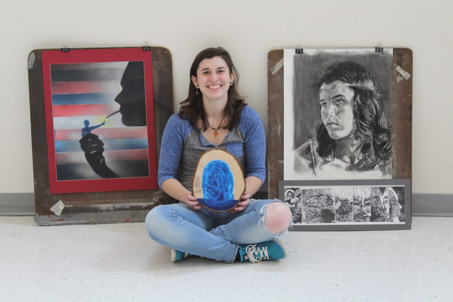Ele Eschenburg poses with several of her pieces.