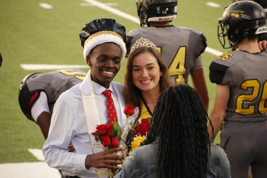 Shardow and Stamets accept flowers after being crowned Homecoming King and Queen. 
