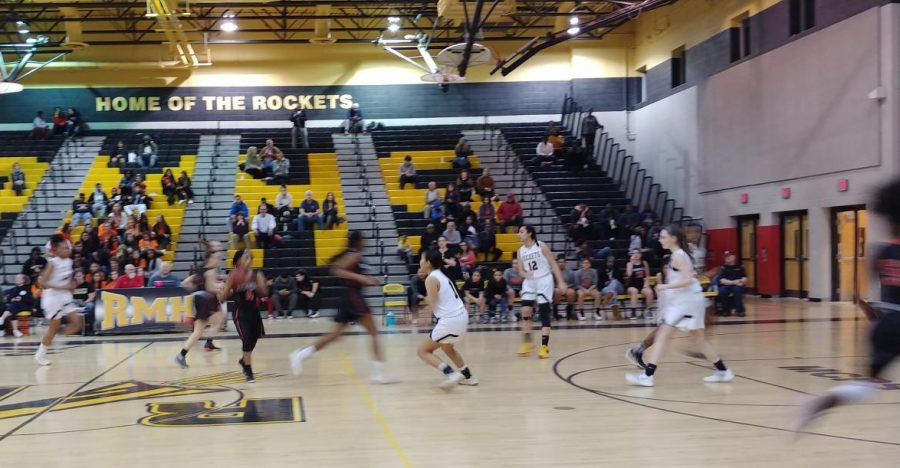 Junior Anujin Dashdorj prepares to block a shot.