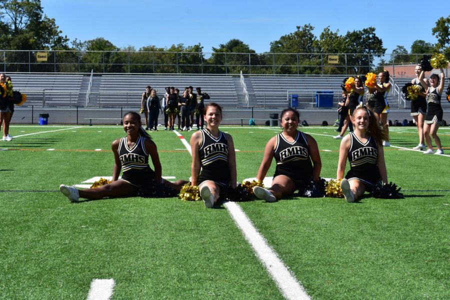 Poms+captains+Brianna+Lacey%2C+Lillian+Matthews%2C+Brigitta+Agung+and+Lucy+Cole+%28from+left+to+right%29+represent+Poms+at+the+fall+pep+rally.