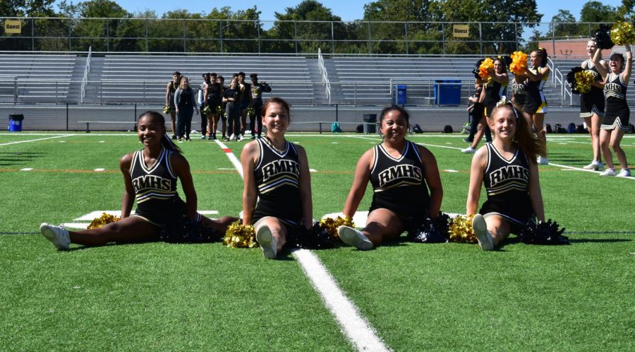 Poms+captains+Brianna+Lacey%2C+Lillian+Matthews%2C+Brigitta+Agung+and+Lucy+Cole+%28from+left+to+right%29+represent+Poms+at+the+fall+pep+rally.
