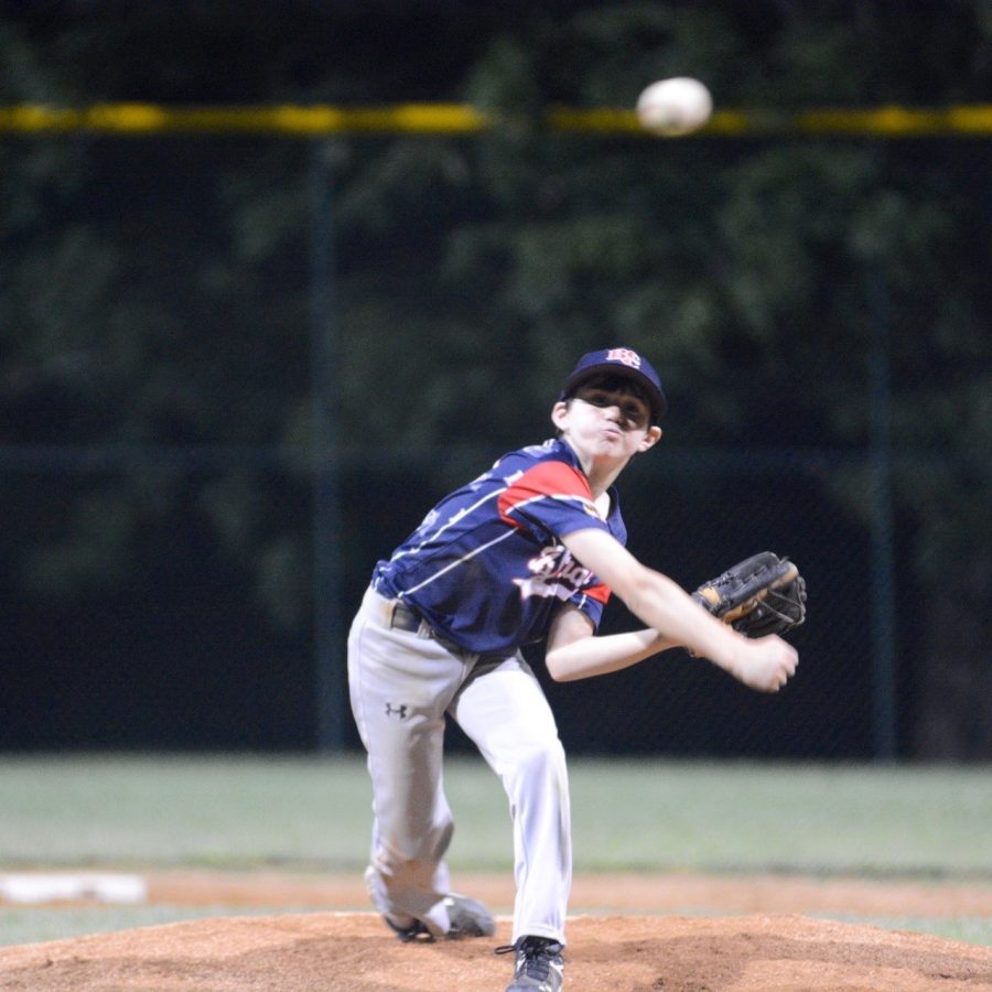 Freshman Zach Wisneski pitching at age 11, before his elbow tendonitis forced him to quit baseball. 