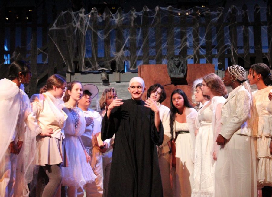 Senior Tudor Postolache lights up the stage in the fall musical as the eccentric matchmaker Uncle Fester.