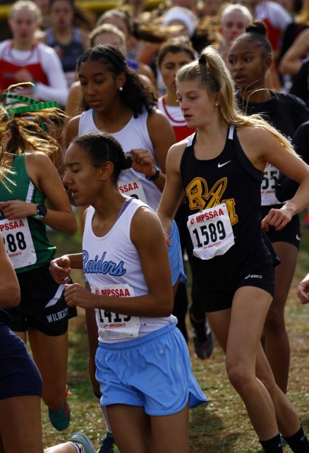 Charlotte Turesson (right) was selected onto the All Decade XC team for MCPS, despite only being a junior.
