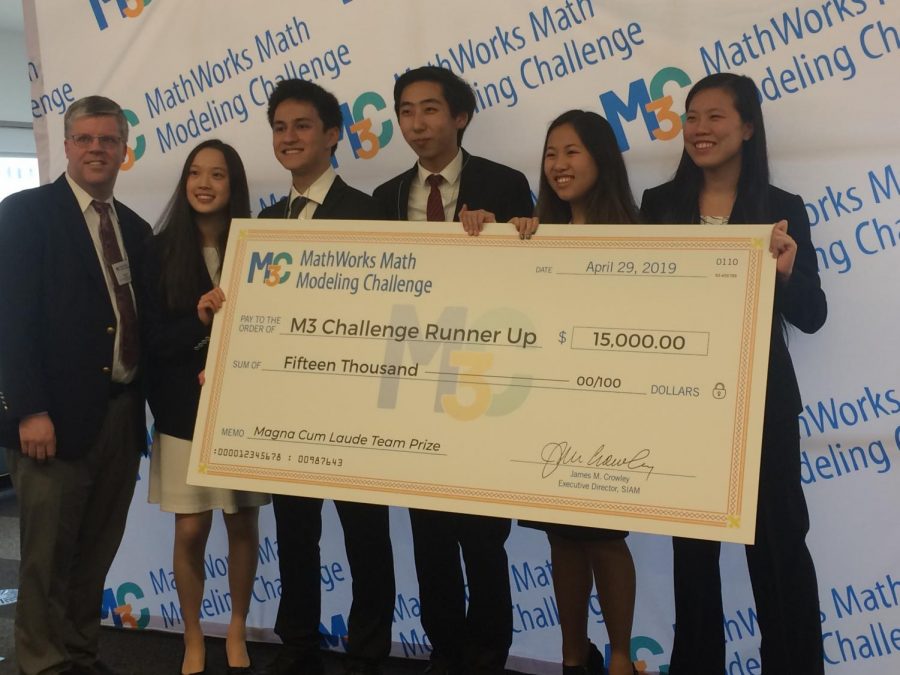 From left, Mr. Davis, Laura Yao, Matthew Kolodner, Jack Yang, Clarissa Xia and Lauren Zhou pose with their $15,000 check.