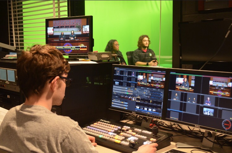 Paul Block (left) coordinates the green screen and camera angles while Caylin Rodgers (center) and Giev Batmanglich (right) prepare to read their lines.