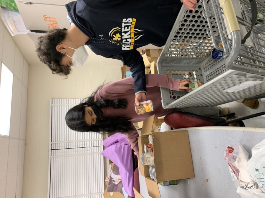 Students Juniors Sam Navarro (right) and Maraly Gonzalez (left) sort cans during their Student Leadership class. The SGA organized the annual Manna Food Drive where students can donate canned food items everyday for a week. Its a great way to give back to the community, Gonzalez said. 