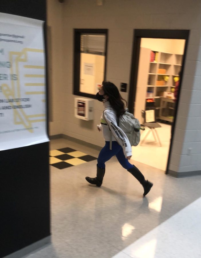 Student Emma Kim races to get to class on time during a hall sweep