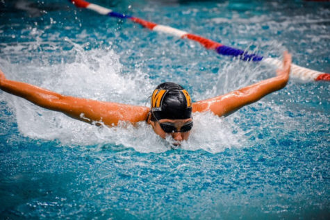 Katherine Blake swims butterfly in the  girls 200 IM