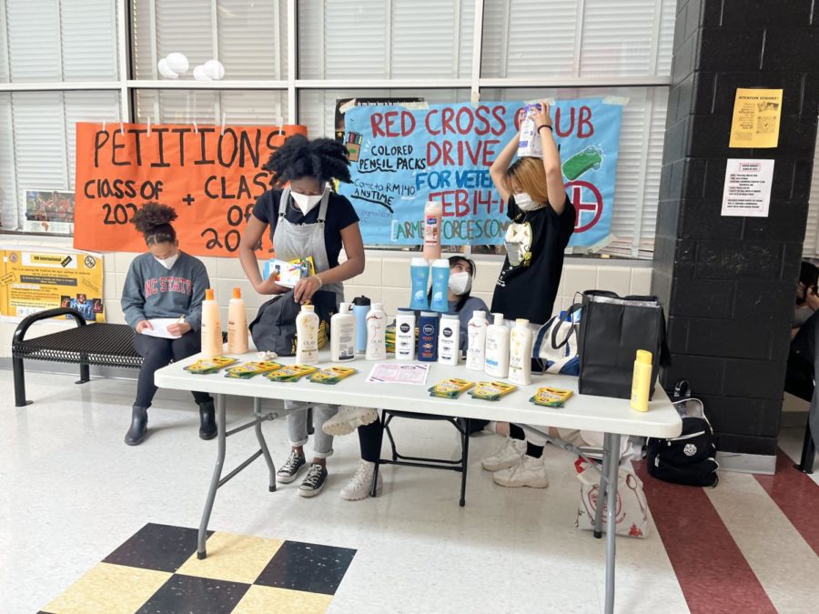 RMs Red Cross club members and seniors Riki Doubia and Kaitlyn Roh set up a table for a supply fundraiser for the benefit of the Armed Force Committee on the week of Feb.14-18. Veterans are such a vulnerable group sometimes that dont have access to the resources they should, Doumbia said. It was important to us to have this drive and allow them to draw, color, and take time to take care of them. The club collected colored pencils packs and body wash during lunch, setting up a table on Main Street.