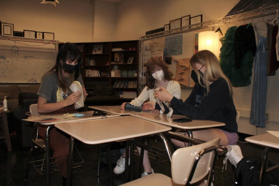 Students in Ms. Hashem-Liless 5th period IB Theatre 1 & 2/Theatre 2 joint class were recently tasked with assembling modified Bunraku puppets using newspaper and masking tape in order to perform a chosen scenario. This group consisted of juniors Rachel Grace, Allison Howlett, and Parker Rock. For the puppets hair, I cut pieces of yarn and lined them up on a strip of tape to make a wig. I couldnt decide what the hair color should be, so I ended up doing half-and-half blonde and brunette. I came up with this idea through inspiration on how hair extensions work. So I figured Id make hair extensions for the puppet, says Grace.