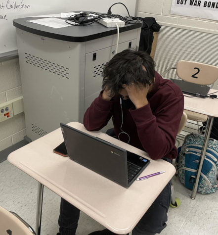 Freshman Shriyans Kalbhor takes a test on his computer, a phenomenon that has become more common as standardized tests switch to a virtual format.