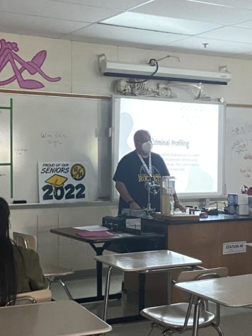 Dr. Kovacs speaks to his fourth period forensics class with a senior yard sign in the background. “I will be putting up a google survey for anyone who’s interested in winning this sign. I’ll be giving away two of them, and I’ll select the winners on Friday, he said. Seniors had an opportunity to purchase the yard signs last week, and along with buying one for yourself, students also had the option to buy some to donate to other students who were unable to purchase their own. 