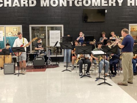 Jamming out in front of the auditorium, the RM Jazz Band puts on a performance during lunch on Thursday, May 26. The band played six songs in total, including fan-favorites like the Rocky theme song, and included solos from Dr. Perry, the director of RMs bands and orchestras. Its not just my music, but its syncing with everyone else: with the percussion, the rhythm, the saxophones, the trombones, the trumpets. When it all comes together, it makes something thats better than the individual parts, senior and trumpet player Samuel Edwards said.