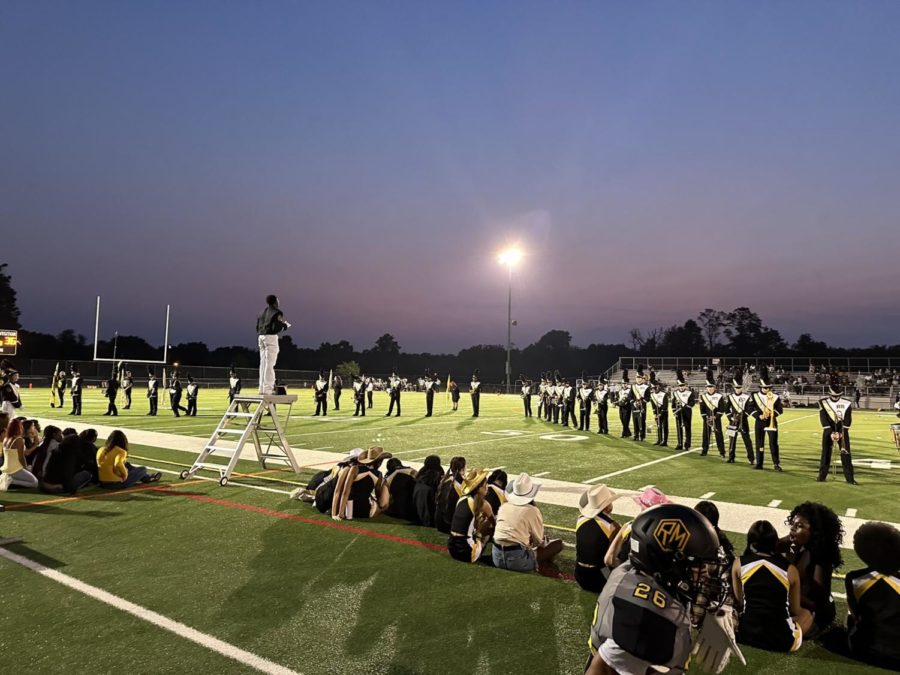 The marching band performs their routine at halftime during a home football game against Bethesda-Chevy Chase HS.