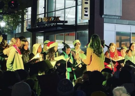The chorus performs on stage at the Rockville Town Square Christmas tree lighting.