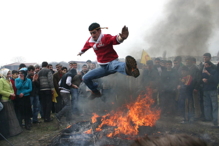 Leaping over a fire is a central aspect of Nowruz celebrations, symbolizing victory over darkness. 