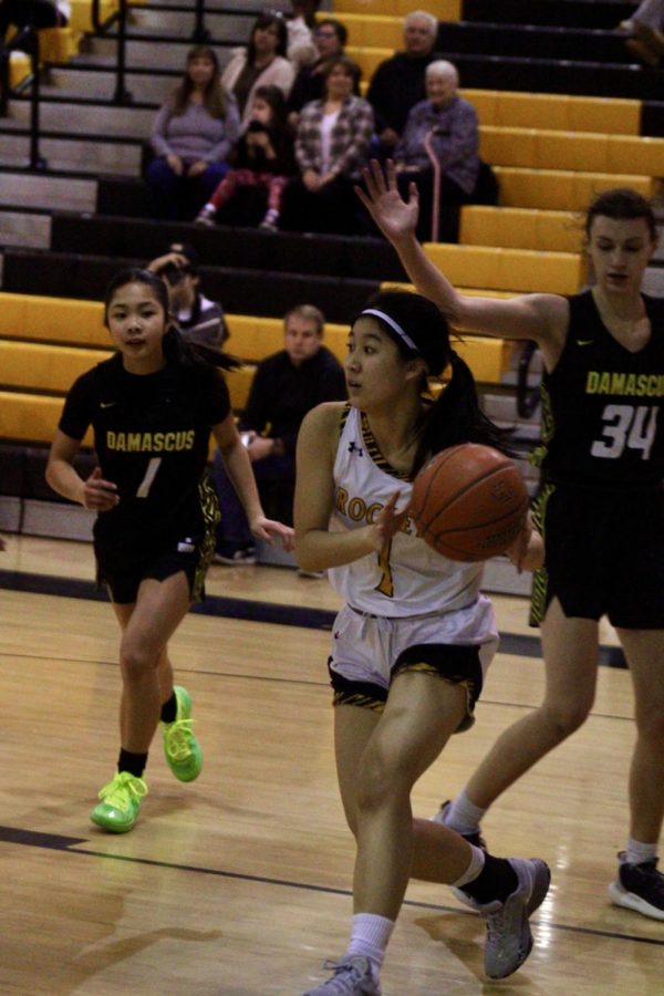 Junior guard Charlyn Chu looks for a pass in a regular season game versus Damascus HS.