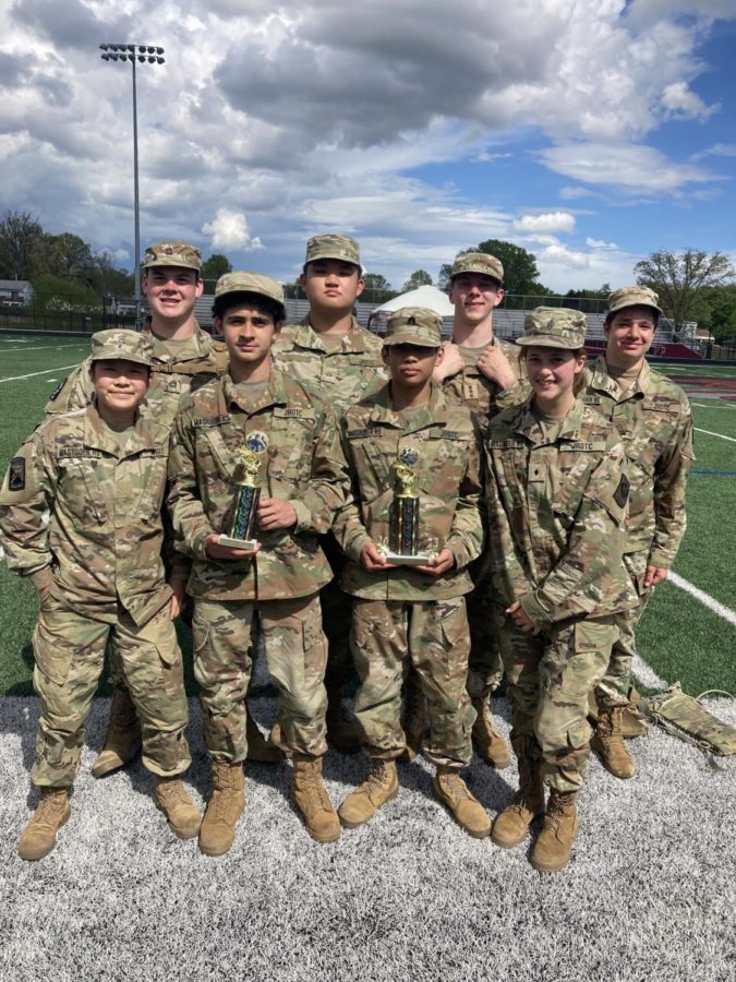 The+JROTC+Raiders+pose+with+their+third+place+trophies+won+during+the+DMVs+Joint+Raider+Meet.