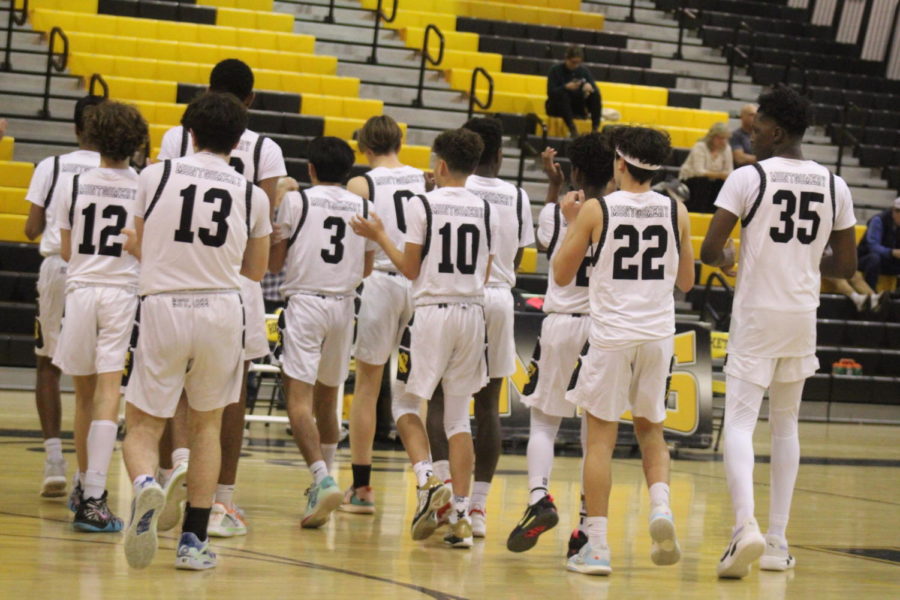 The+JV+Boys+basketball+team+get+energized+for+a+regular+season+basketball+game+against+Quince+Orchard+HS.