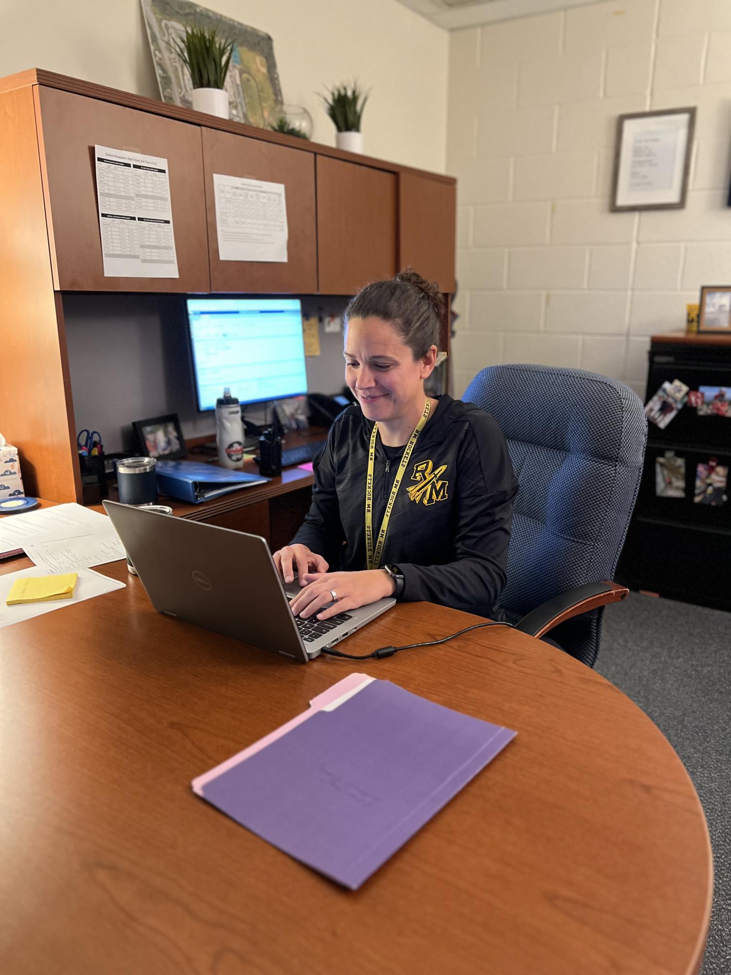 Ms. Sara Baudry, the newly-appointed freshman administrator, prepares for a meeting with students.