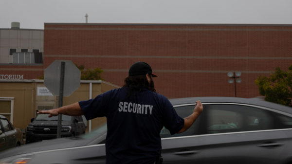 Photo of the Day: Parking lot traffic requires security guard to step in