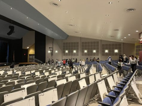 Students exit the auditorium following the IB Spanish exam.