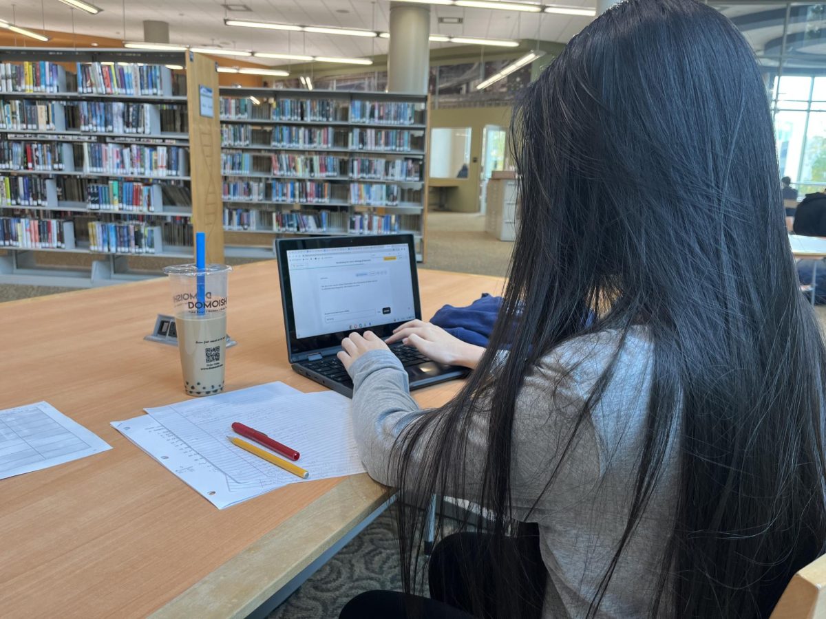 Sophomore Victoria Zhong works on homework and reviews for upcoming tests in the quiet environment of the Rockville Library.