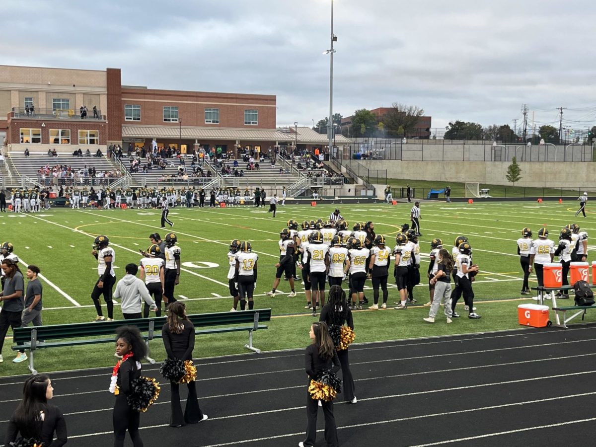 The Rockets gather on the sideline before the beginning of their game against Seneca Valley HS.