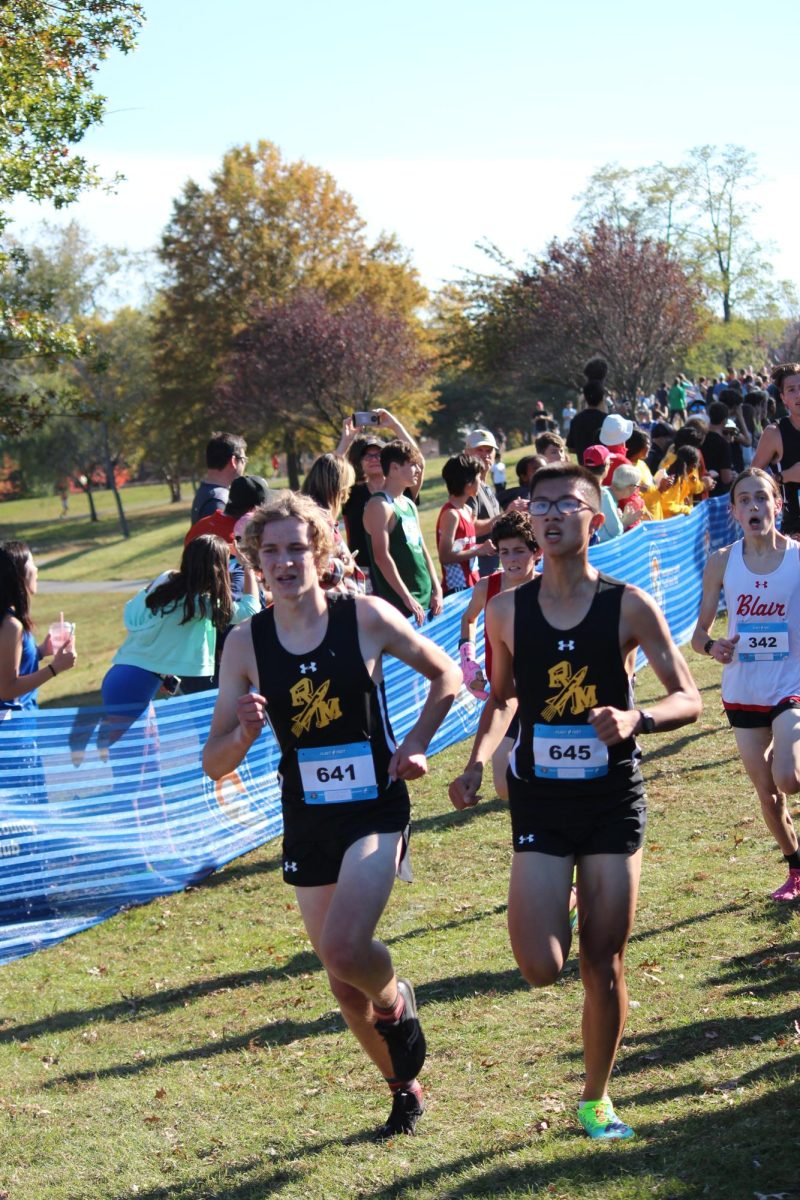 Junior Kylen Tow (right) and senior Tillman Peters (left) race towards the finish line at the 2022 County Championships.