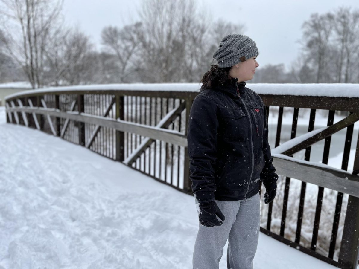 Senior Emilia Souchar admires the snow during a walk around her neighborhood.