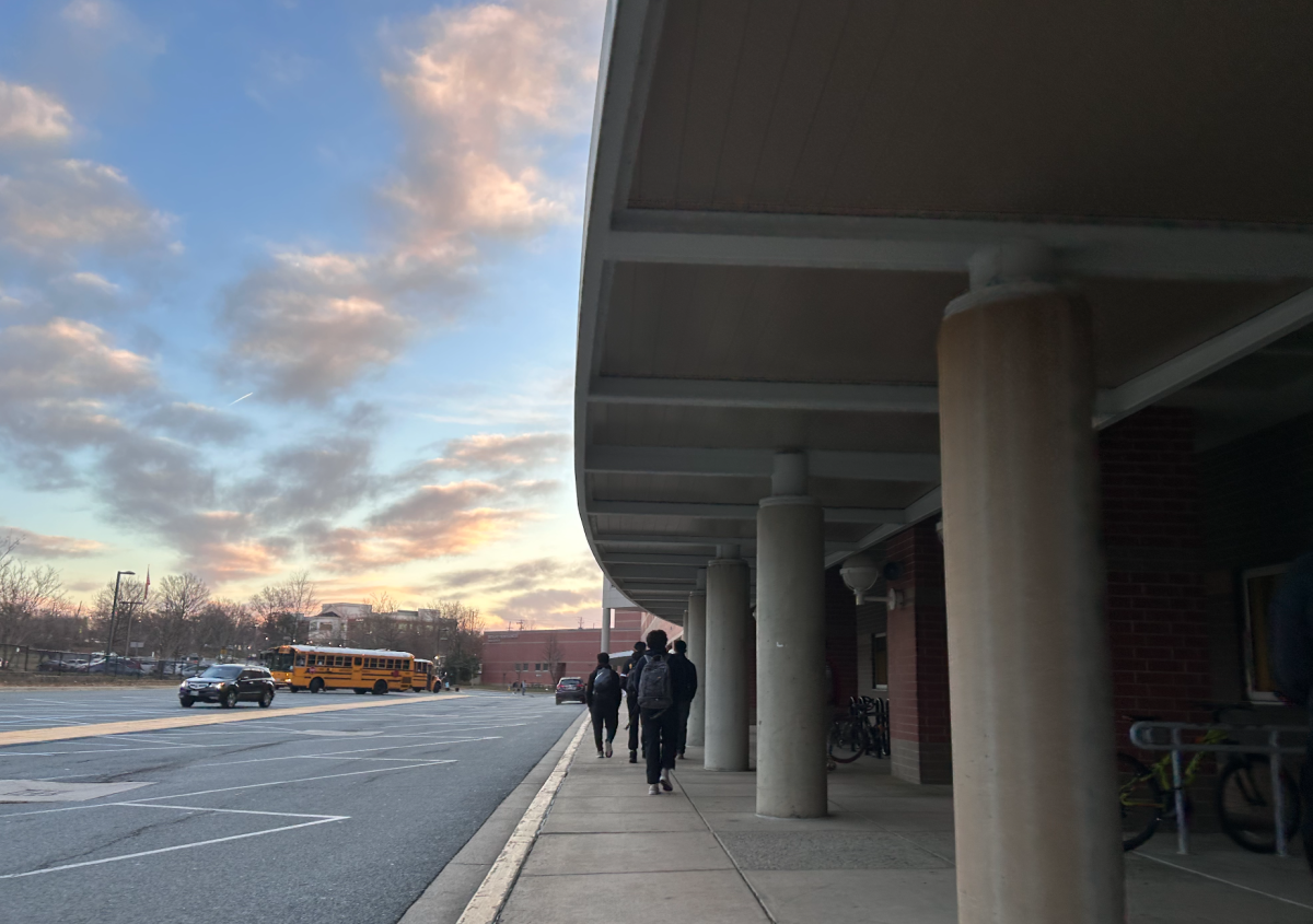 RM students walk towards one of two entrances open in the morning. Students are required to show their school issued ID in order to enter the building. 
