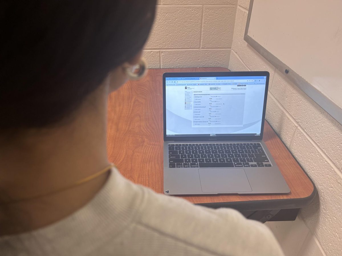 An RM student checks their grades following the implementation of new grading guidelines by MCPS. 