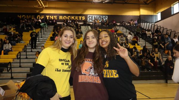 Juniors Caroline Kaye, Ema Djordjevic and Corinne Howard pose during the 2024 upperclassmen pep rally. Kaye, Djordjevic and Howard are three of the four captains of the girls varsity volleyball team that won the state championship this school year for the first time in RM history. “Nothing could ever compare to that feeling honestly, like all of our work and strength had completely paid off,” Howard said.