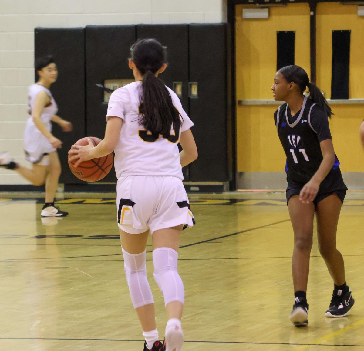 Sophomore guard Katie Diao dribbles down the court and looks for a teammate.