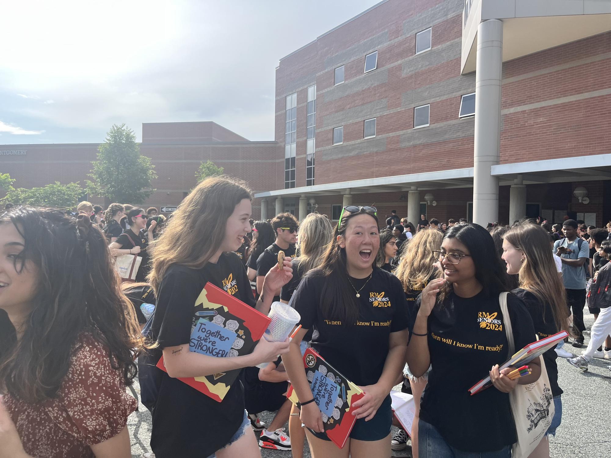 Seniors Gabby Mendelsohn, Ifrah Reyal and Pearl Mitchell laugh together during the Senior Sendoff on May 24. I will miss all the people and teachers at RM, Mendelsohn said. But I am excited for the summer and college.