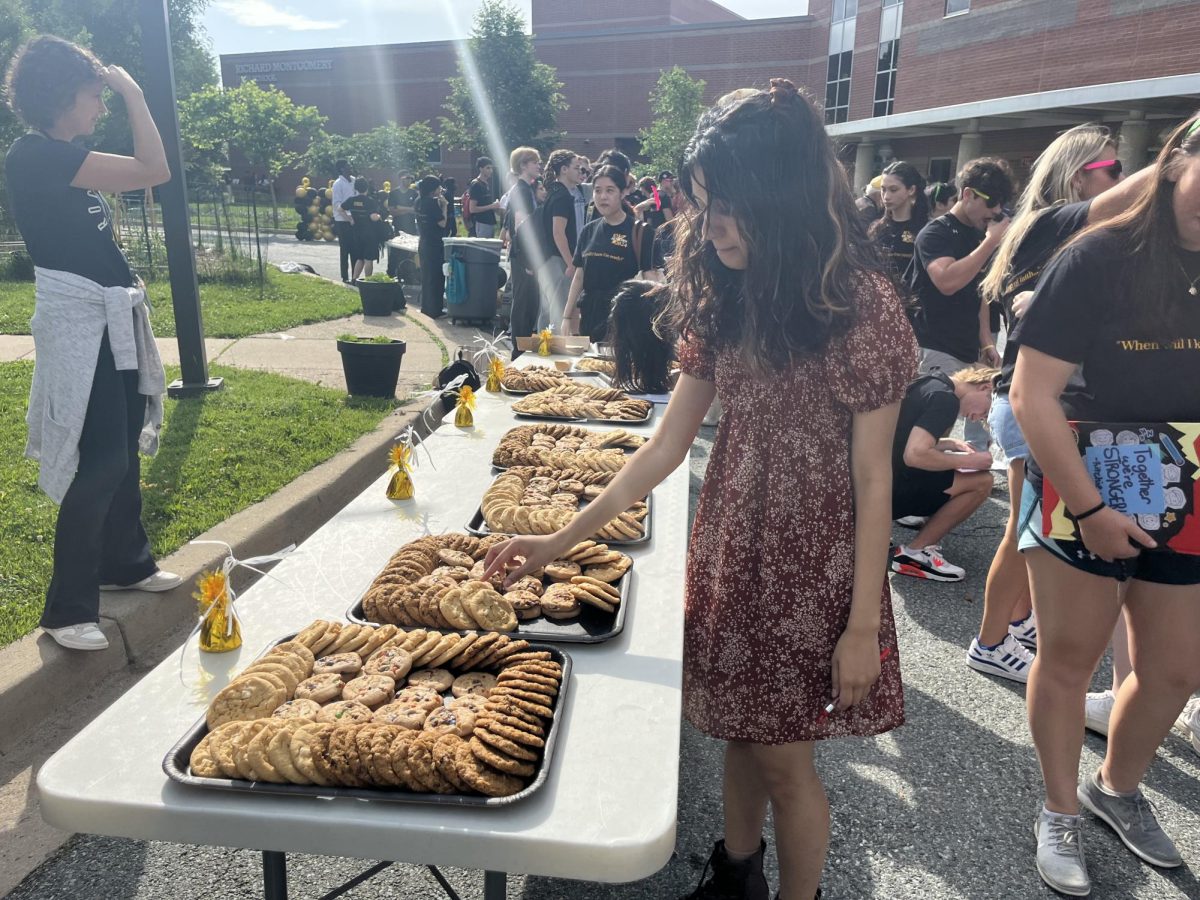  
 	
Senior Riona Sheikh selects a cookie from the refreshments table at the Senior Send-Off on Friday, May 24. 