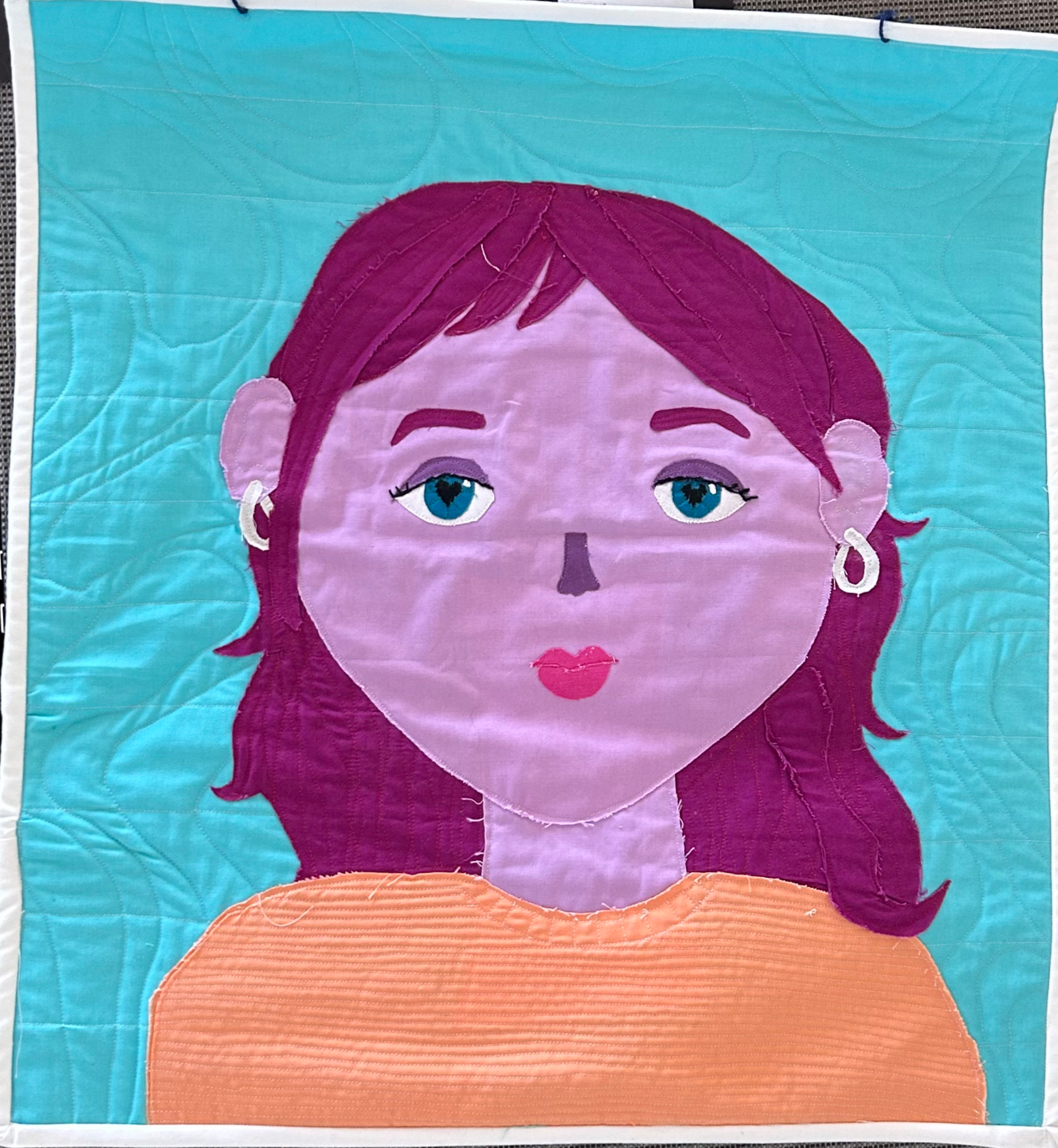 Senior Arielle Schmeidler captures her personality in a quilt titled Self Portrait. 