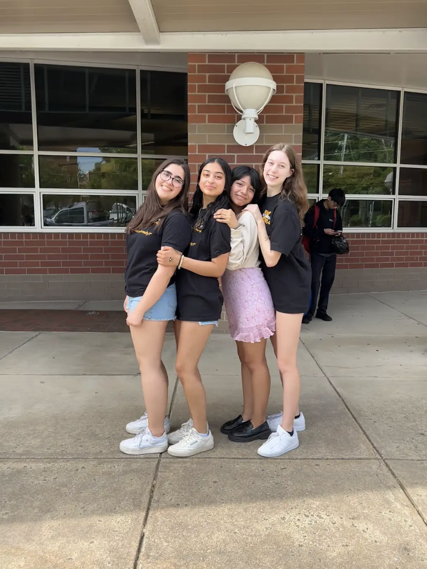 Seniors Mayah Nachman, Ashna Uprety, Ruby Rojas, and Gabby Mendelsohn pose for one last picture at the senior sendoff in the bus loop. Im going to miss seeing my friends everyday, Mendelsohn said. But I am glad to be done with high school. 