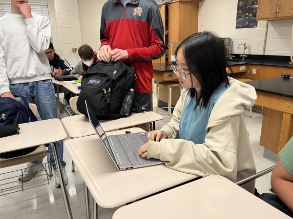 Junior Rachel Wei works on her laptop while her teacher uses the new Lightspeed monitoring tool.