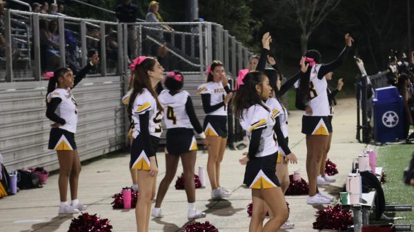 The cheer team warms up before a football game.
Photo courtesy of Hannah Klun