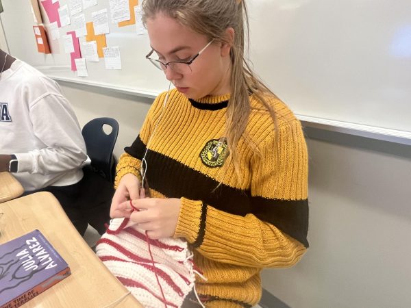 Weaving through Rocket Refresh, Senior Emily Perkins crochets her Christmas-themed hat. Rocket Refresh is a time for students to catch up on work, make up assignments, relax and do what they wish. "I really love Rocket Refresh because I can actually get a break. When I don't have too much work to do, I like to bring in my crochet work to just relax and listen to music," Perkins said.