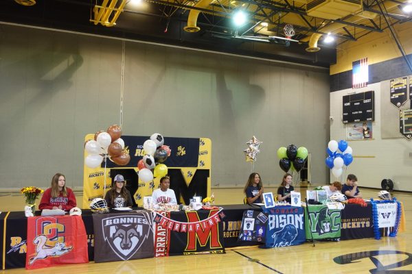 Senior student athlete college commits sign to play at the next level on National Signing Day. 
Photo courtesy of Catherine Nguyen