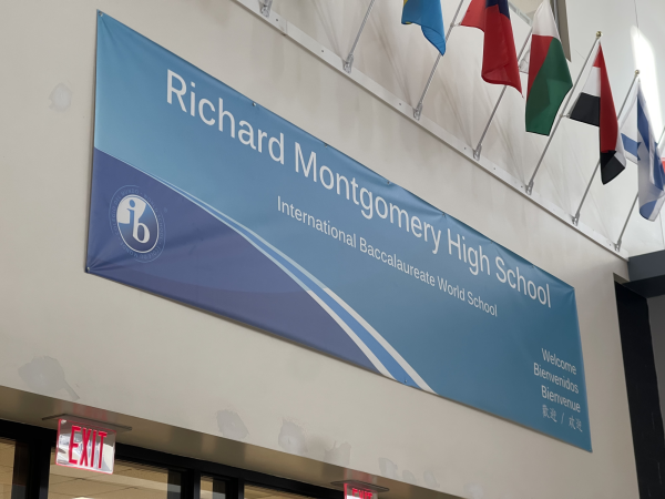 A banner featuring RM's International Baccalaureate program hangs above the main entrance.