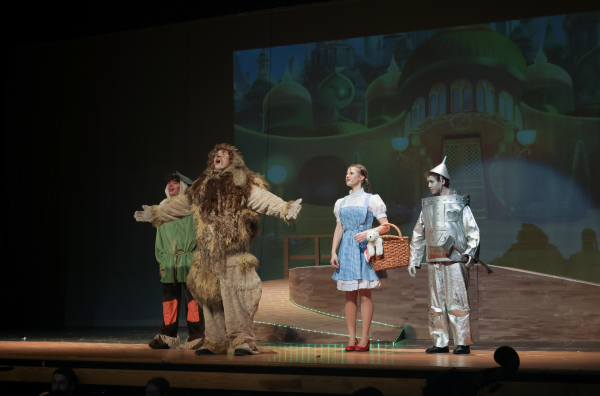 Cast members perform on-stage. From left to right: Juniors Cory Breychack and Quinn Creel, seniors Eliza Petrova and Noah Lechheb. Photo courtesy of Erin Caplan.