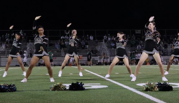 The RM poms team begins their halftime performance on Friday night lights. 