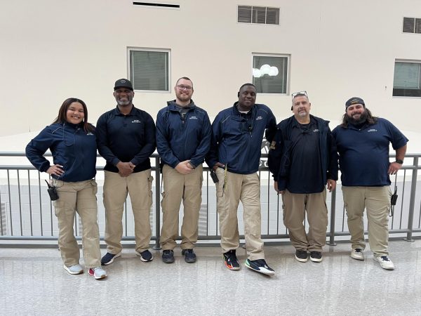 The security team poses in uniform on Main Street.