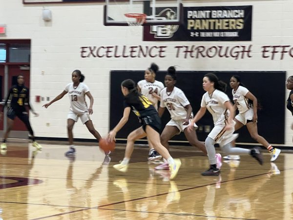 Freshman Juliana Fire (black #10) pushes through a 2-3 defense. “Against difficult defense I try to stay composed and not panic, keep my head up so I can see the whole court and see who’s open, while working to keep my dribble low and controlled so the defense is less likely to steal it. Also, communicating with my teammates helps ensure we are all in the correct positions against the specific defense to allow us to get the ball where we want it to go," Fire said.
