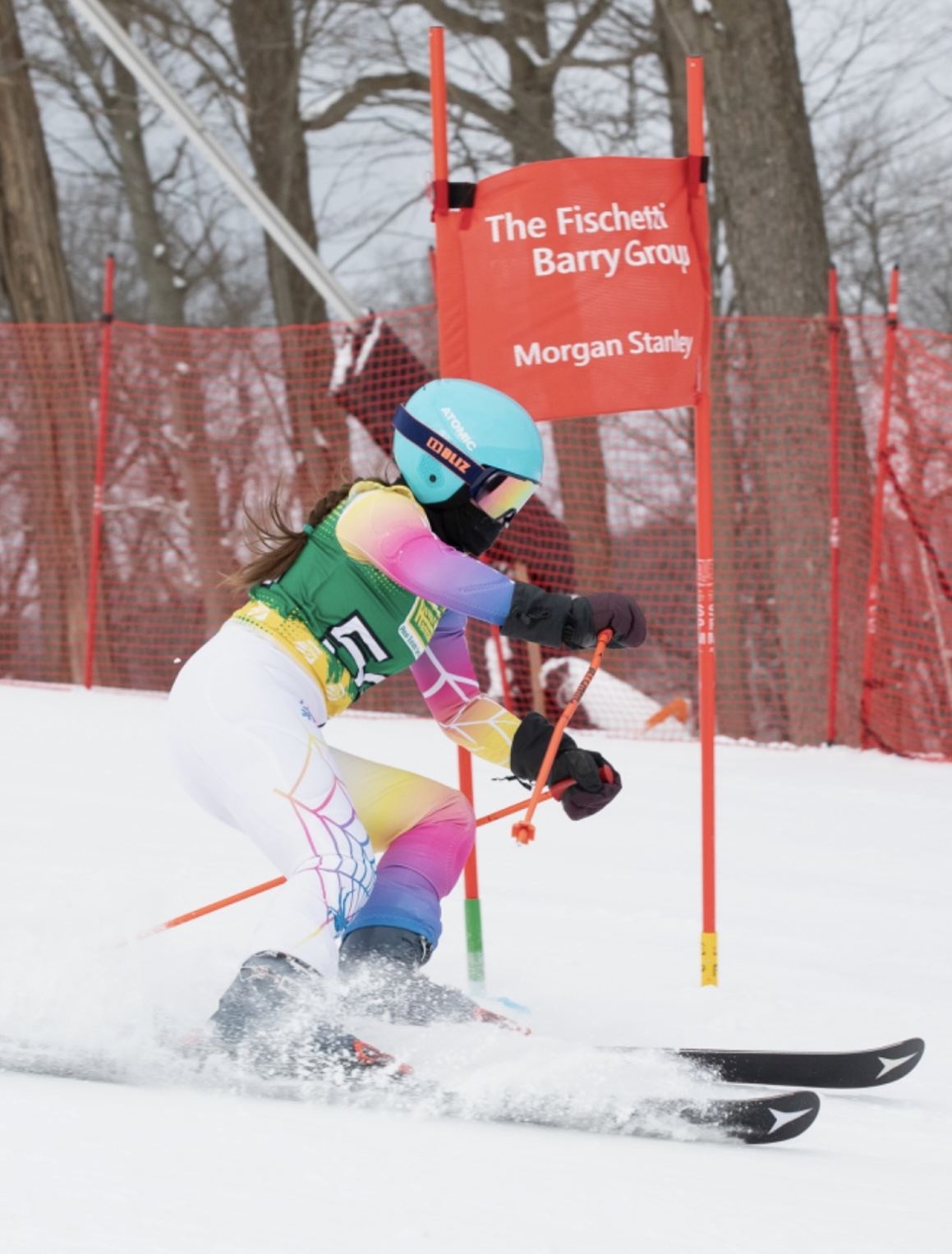 Ewig skiis down a slope during a ski race. “Ski racing is like a rollercoaster, and it makes me feel a rollercoaster of emotions. It gives me a surreal feeling that is sometimes good, but also sometimes scary,” Ewig said.