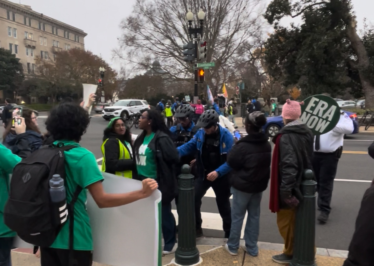 RM students hold signs at the Equal Rights Amendment protest Dec. 10.